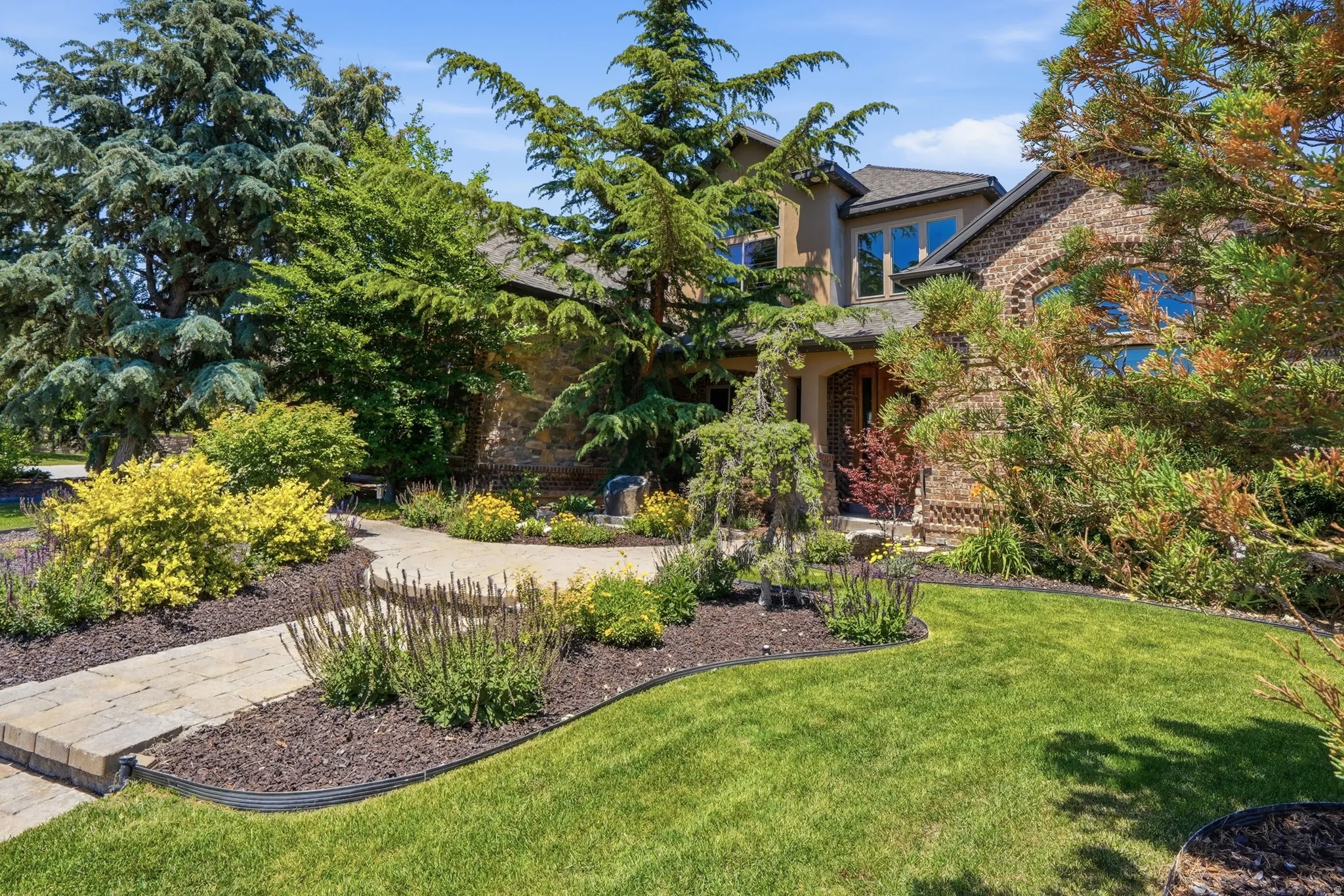 Stately exterior featuring a combination of brick and stucco finishes
