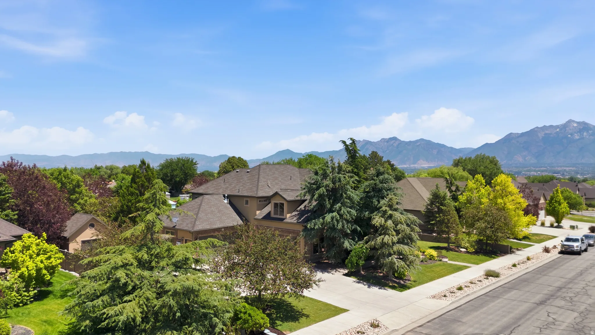 Spacious property with a multi-gabled roofline and a neutral-toned exterior