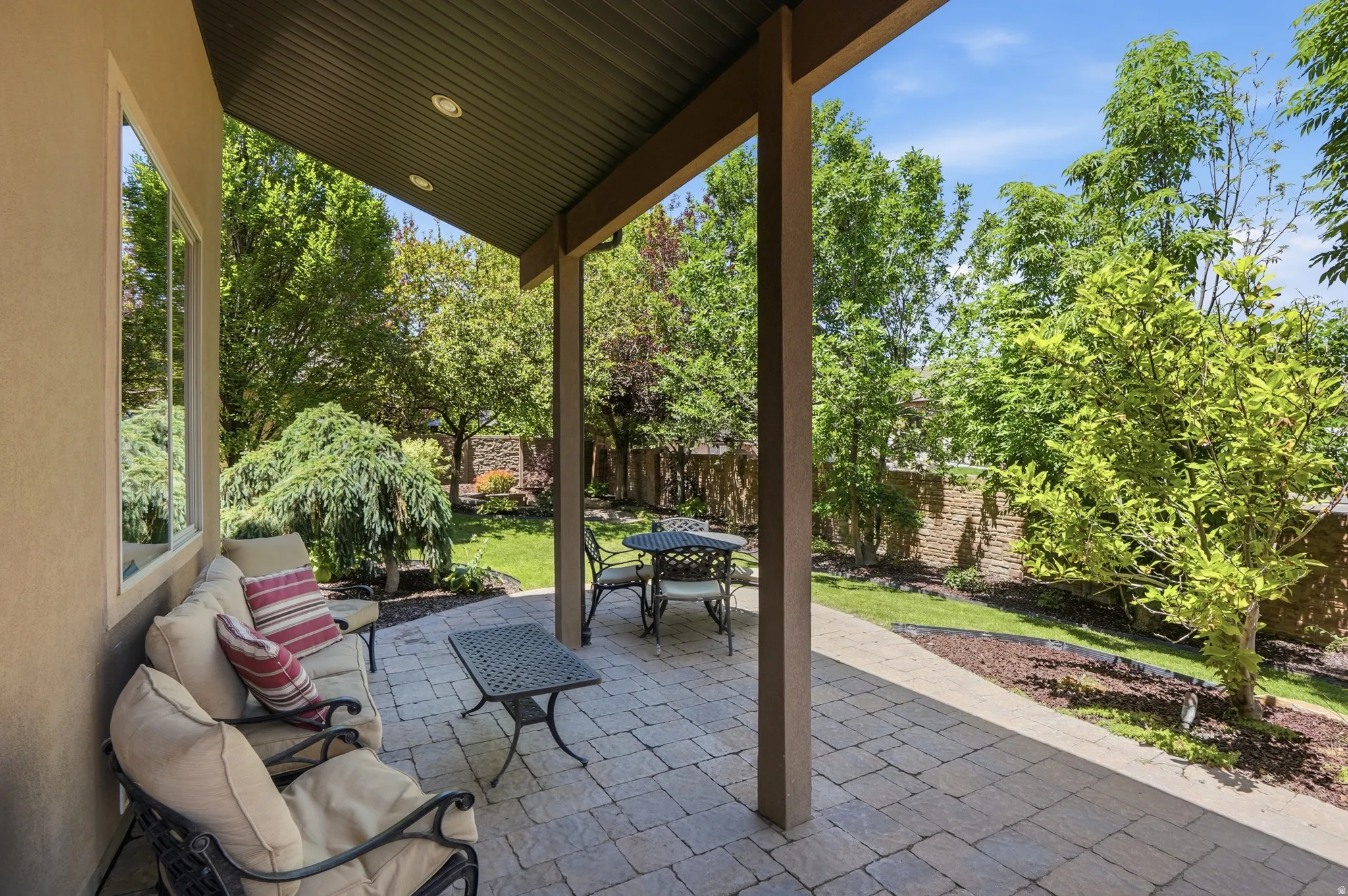 Covered patio featuring paver stone flooring and recessed lighting