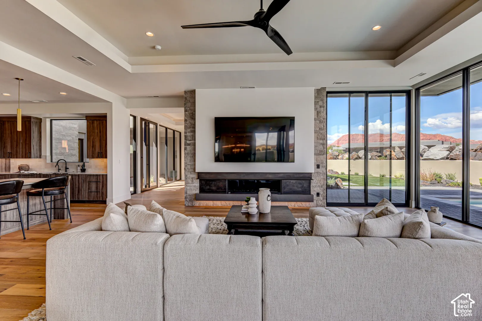 Wood-finish flooring, recessed lighting, and a modern ceiling fan