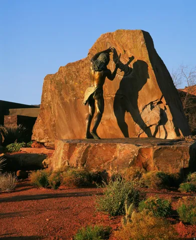 Bronze sculpture on a substantial natural rock formation