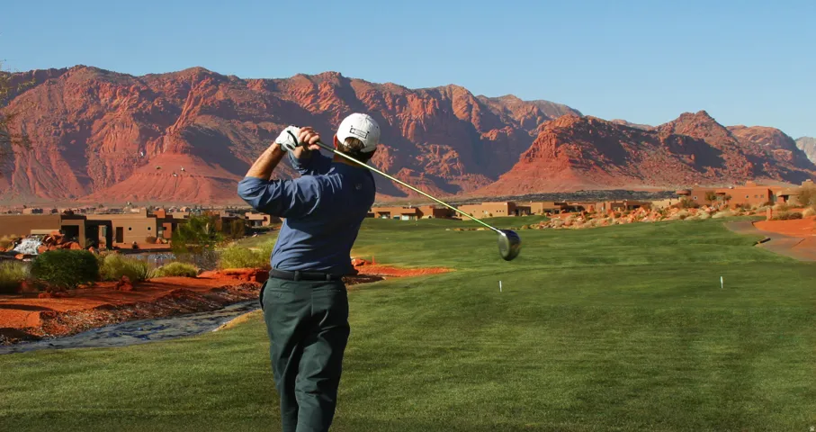 Golf course setting with manicured greens and natural desert landscaping