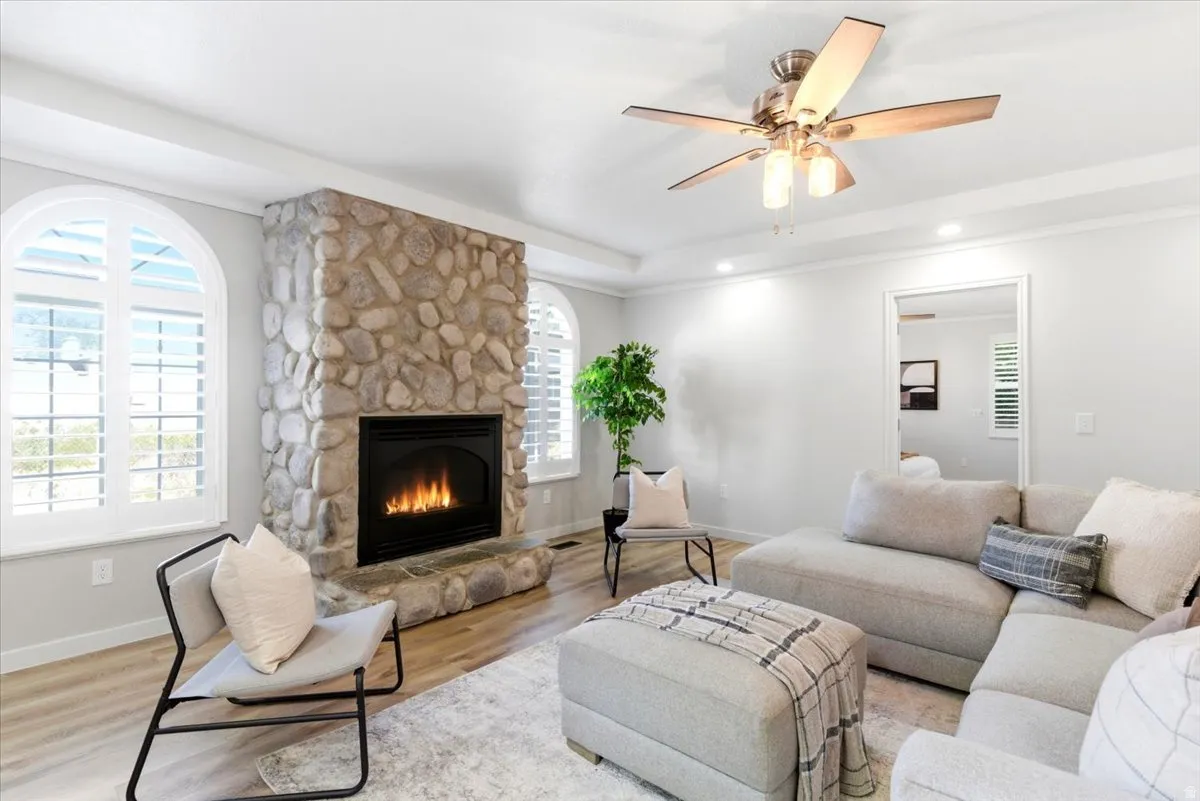 Stone-faced fireplace with a black firebox and hearth
