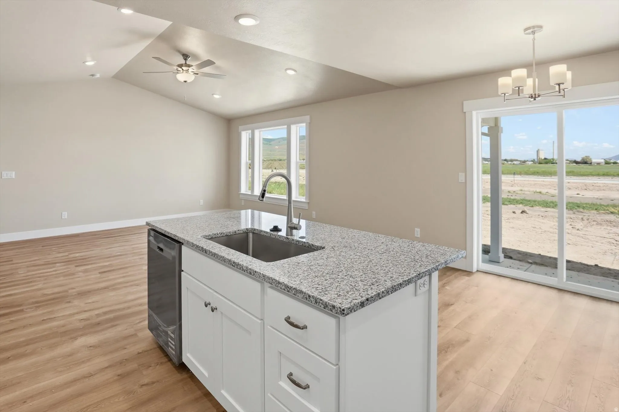 Kitchen island with granite countertop and undermount sink