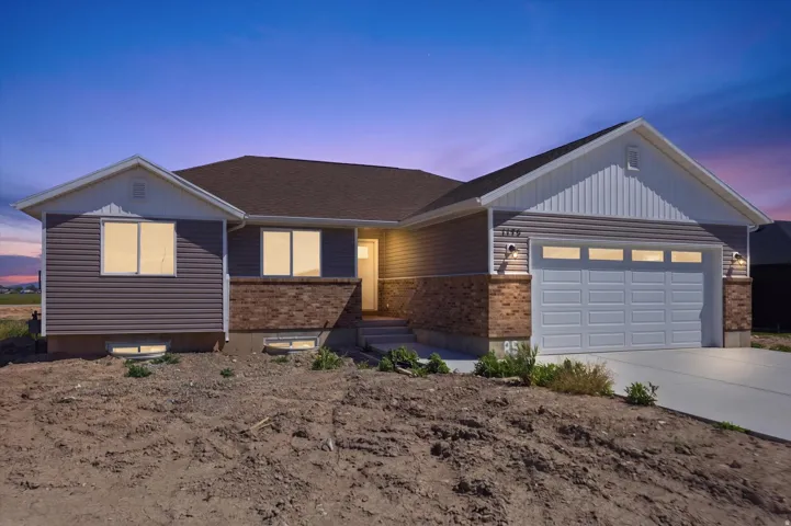 Single-story residence featuring a combination of brick and horizontal siding