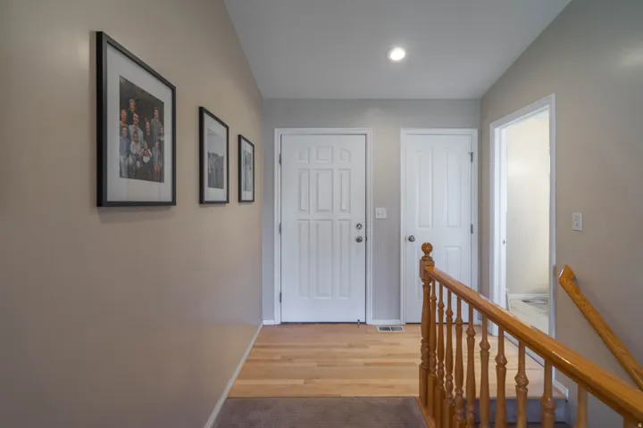 Entry with coat closet and half bath on right side