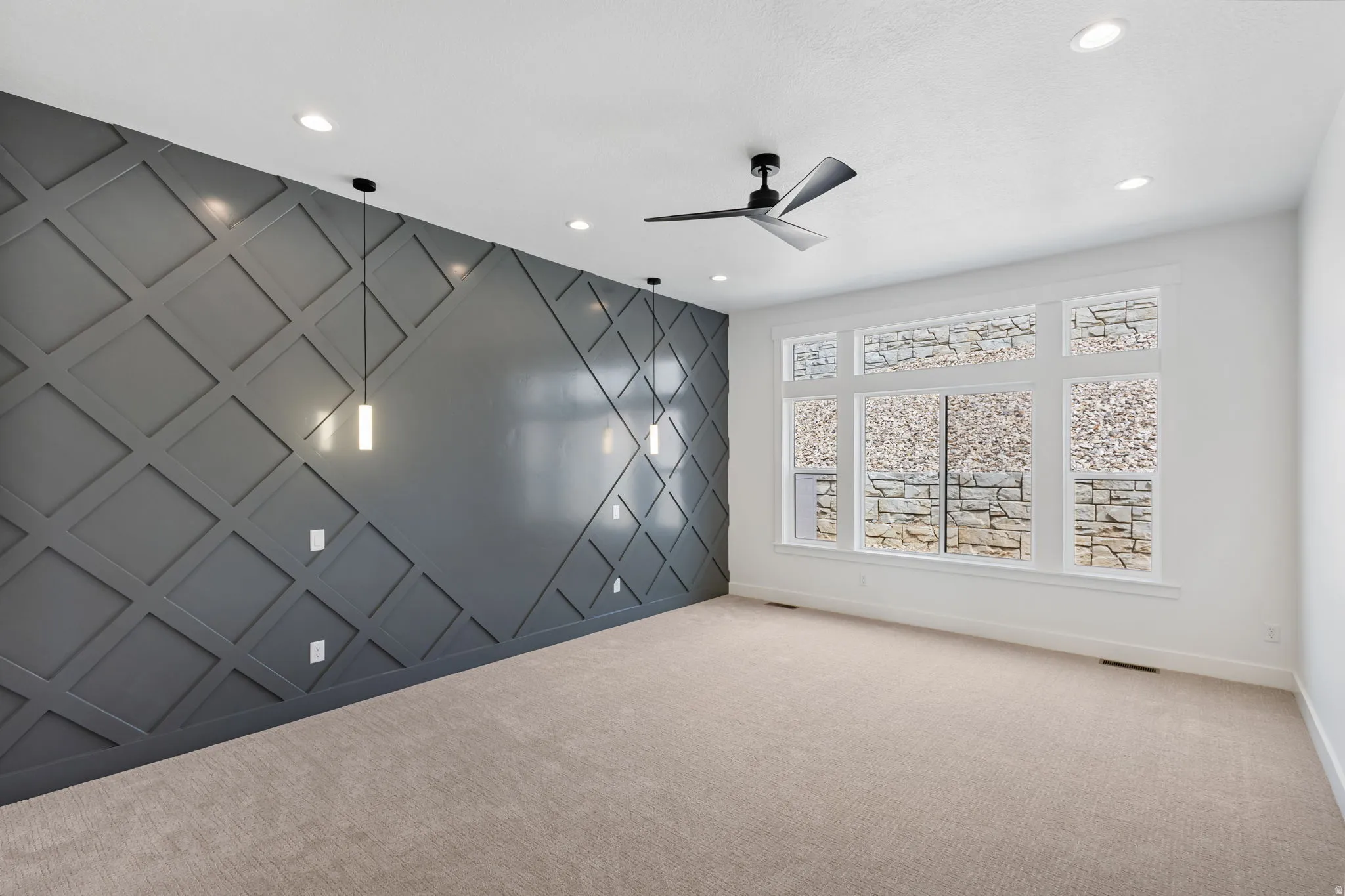 Primary bedroom with accent wall.