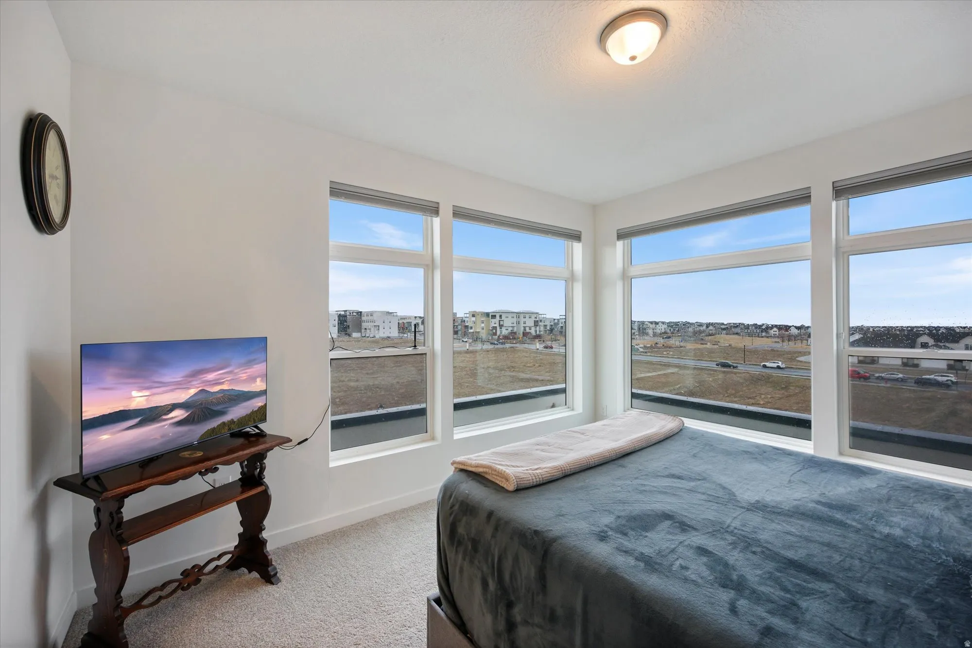 Expansive corner room featuring an abundance of natural light from multi-directional windows