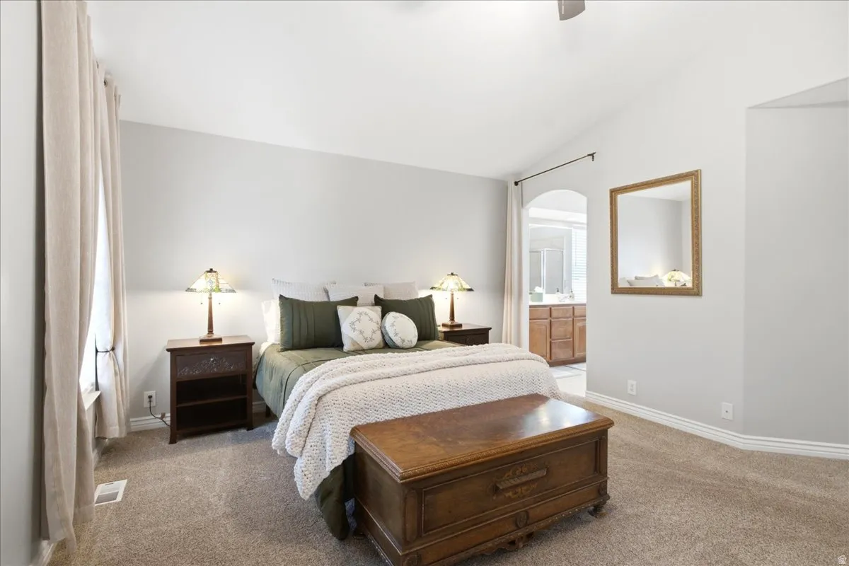 Vaulted ceilings in primary suite bedroom