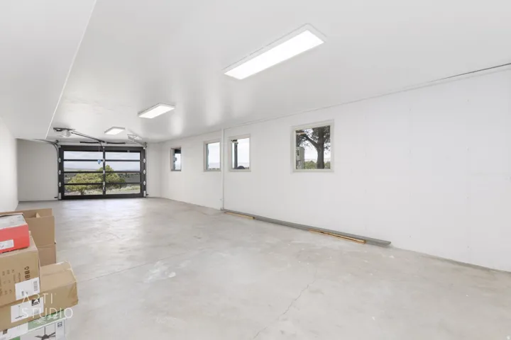 Spacious garage with a full-view glass overhead door