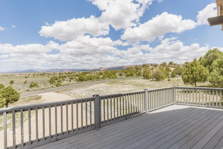 Expansive outdoor deck with gray composite decking and matching railing system