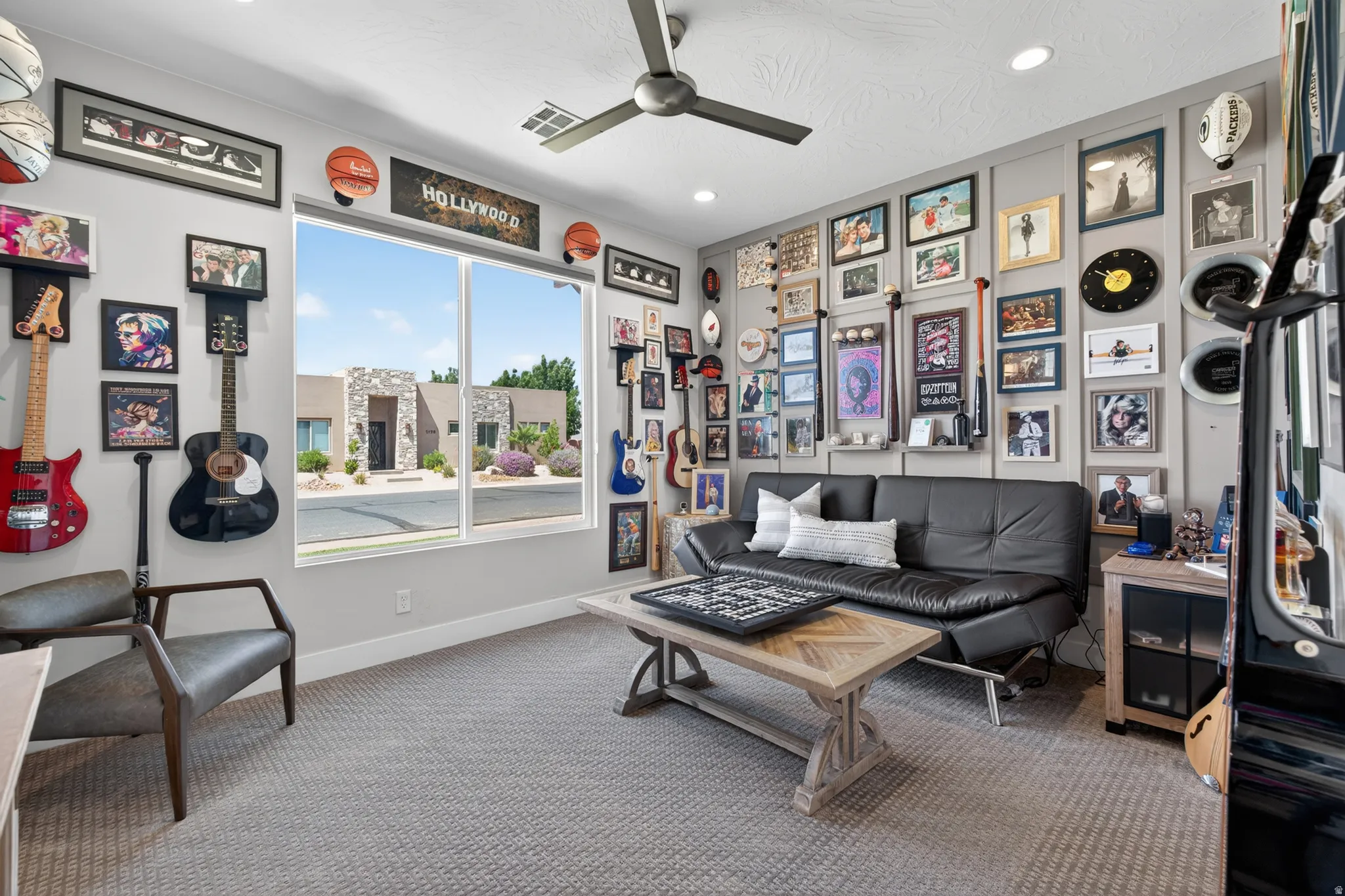 Carpeted room with a large window, recessed lighting, and a ceiling fan