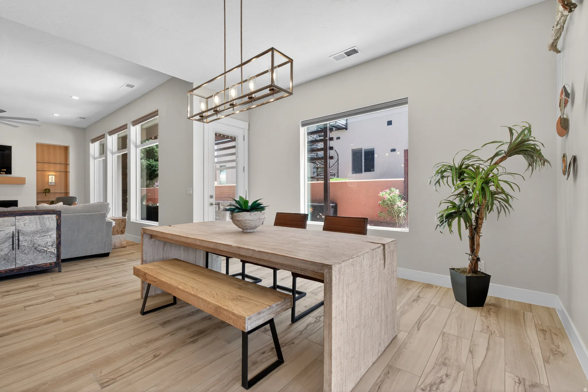 Spacious dining area featuring wood-finish tile flooring and a rectangular window