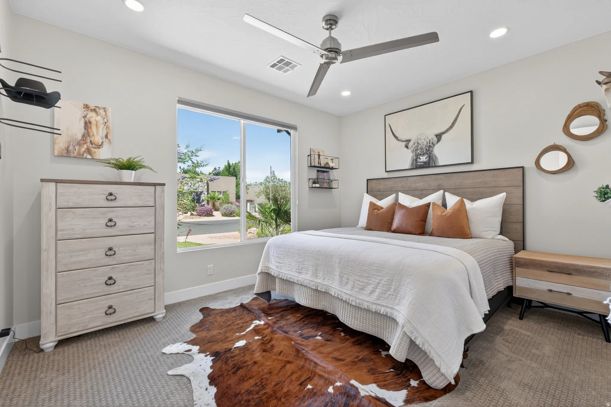 Bedroom featuring a large window, recessed lighting, and a ceiling fan