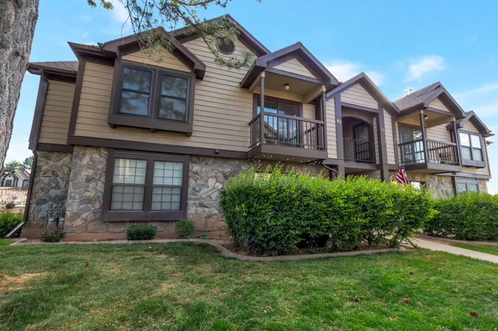 Stone veneer and siding exterior with multiple balconies