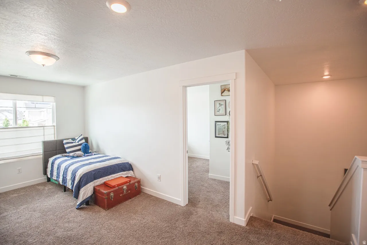 Carpeted room with a multi-pane window and a built-in window ledge