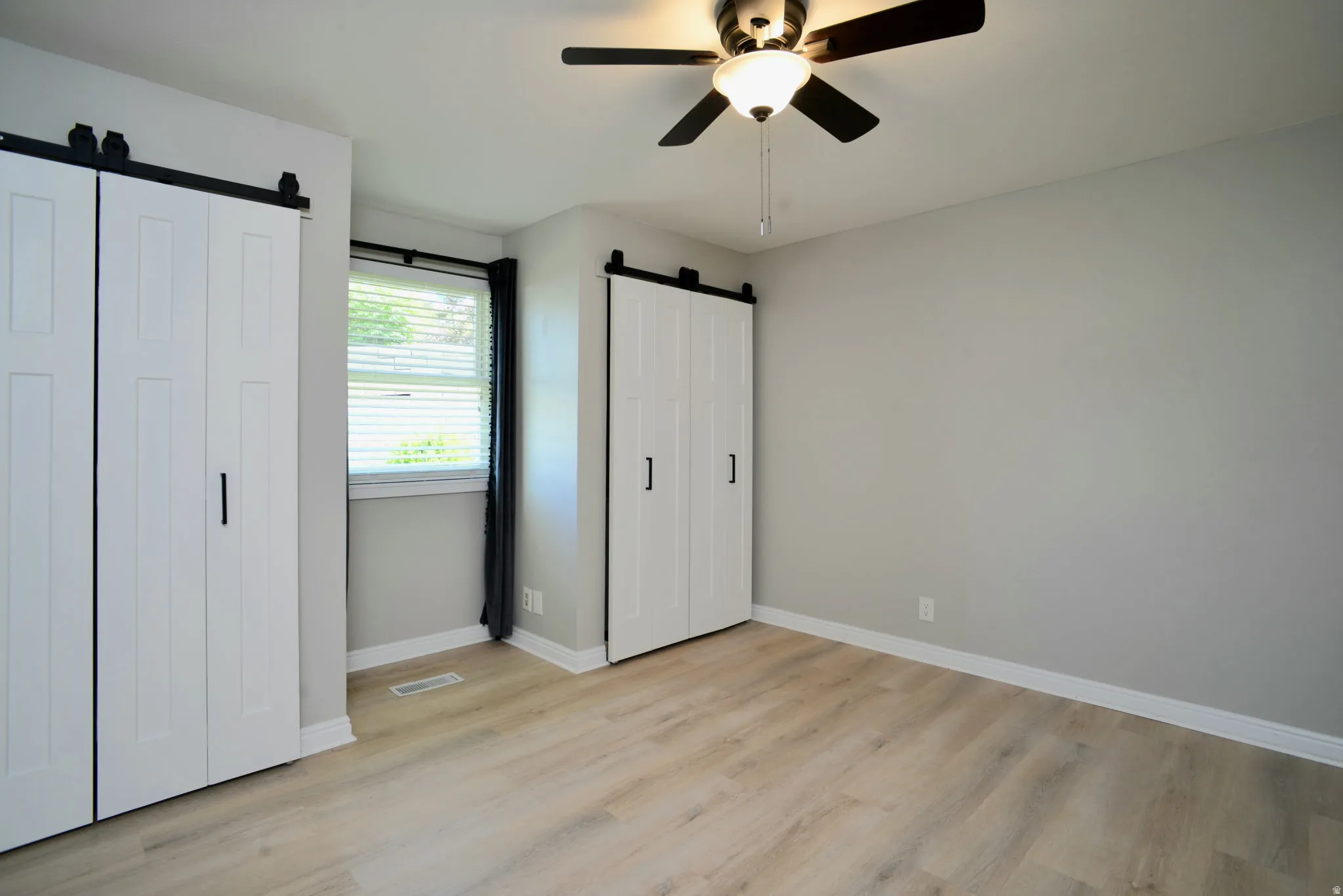 Master Bedroom Double Closets with Area for Cozy Chair