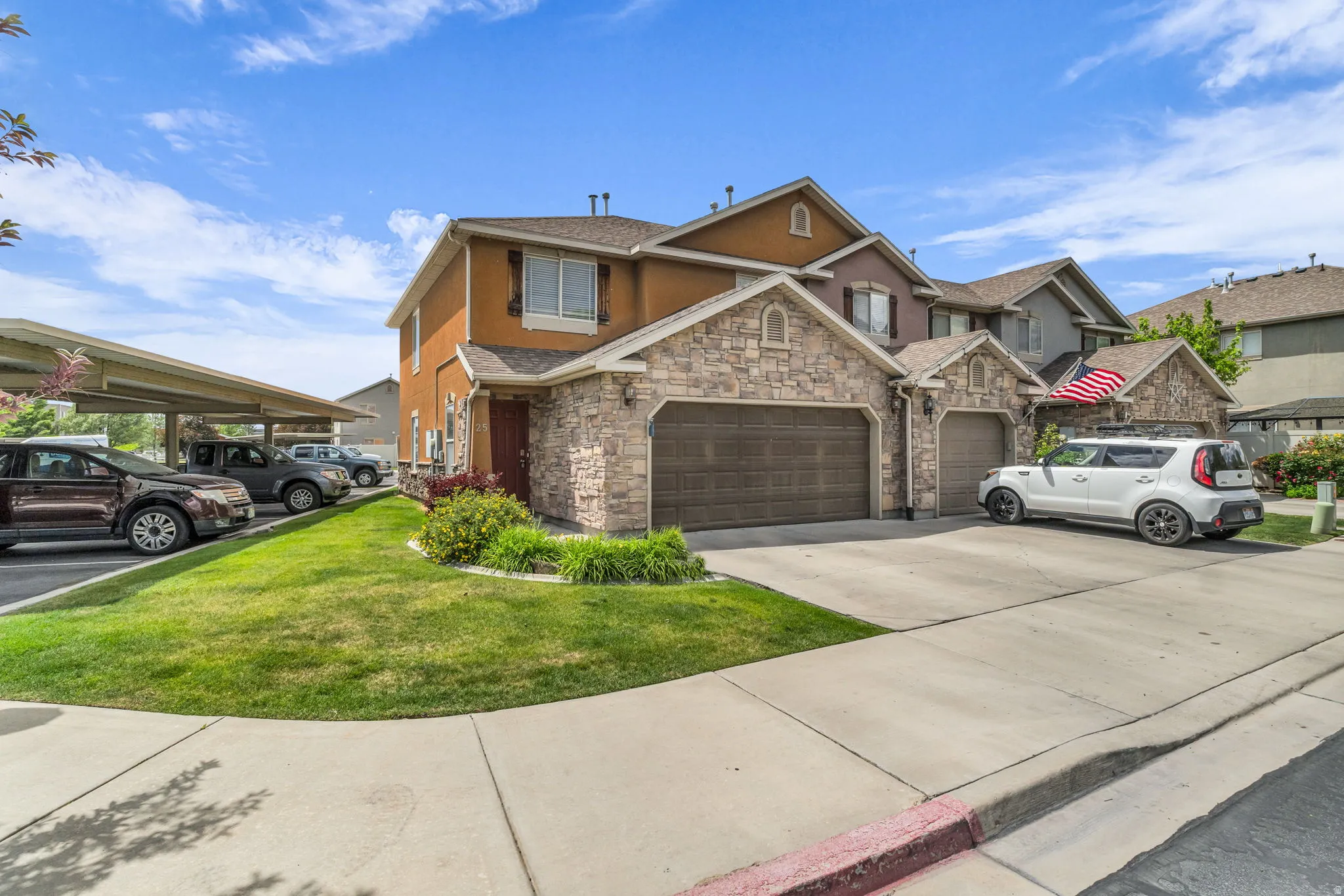 The end-unit location provides added privacy, and the attached 2-car garage offers extra convenience and storage.