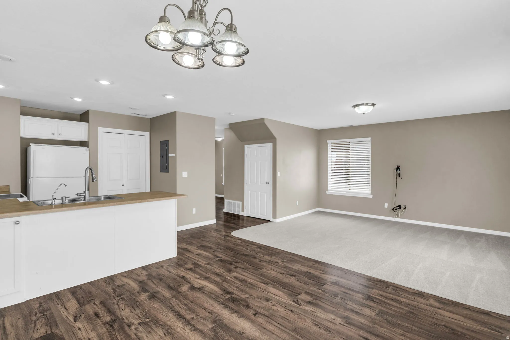 The kitchen flows seamlessly into the dining and family spaces, making it ideal for everyday living and entertaining.