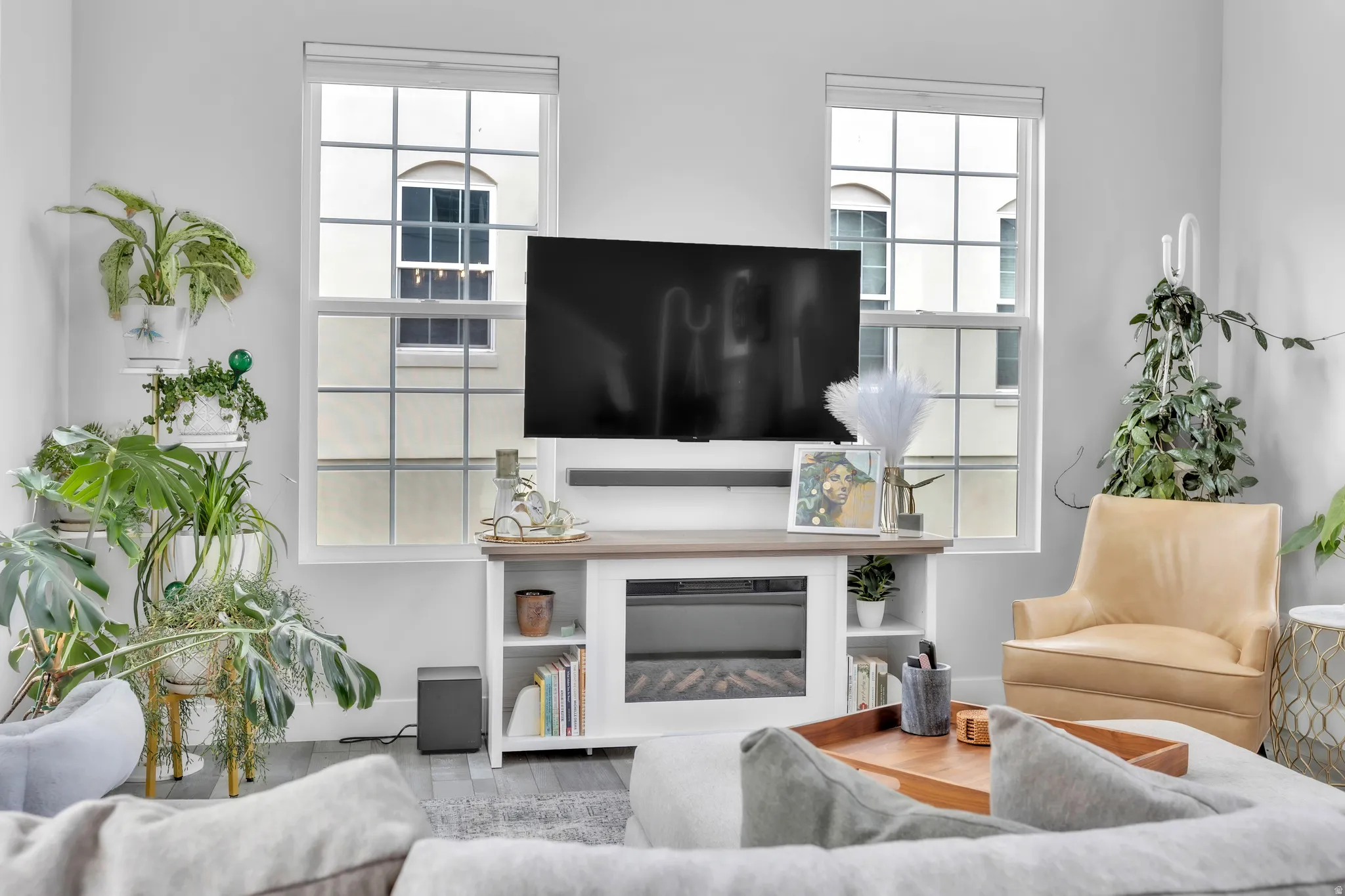 Living area featuring wood-finish flooring and two large paneled windows