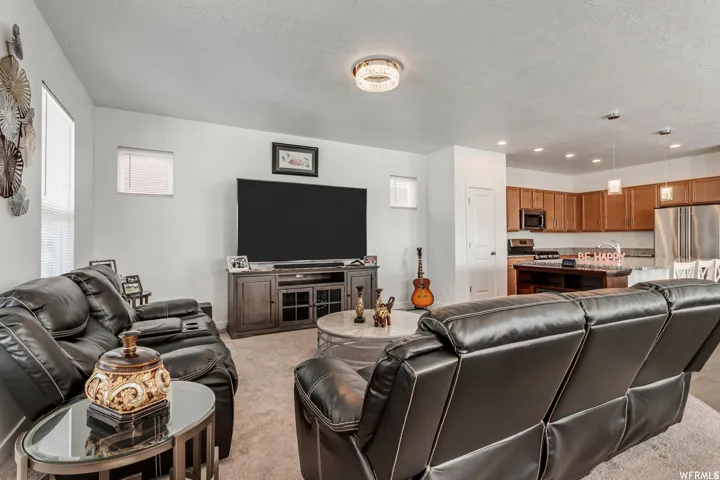 Open-concept living area with a direct sightline to the kitchen