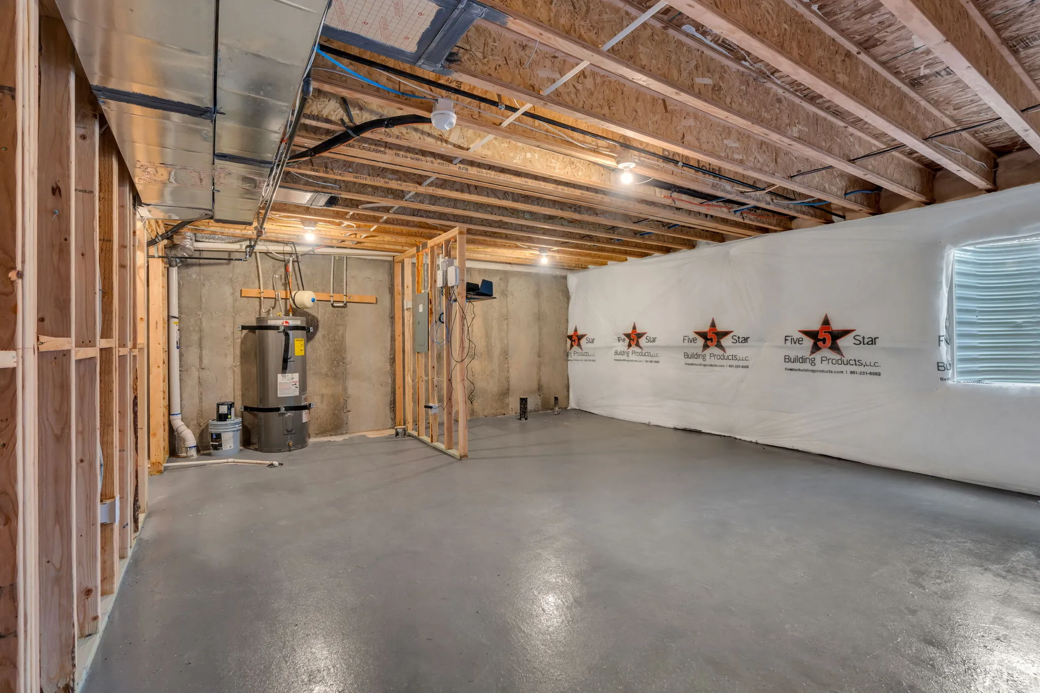 Unfinished basement with concrete flooring