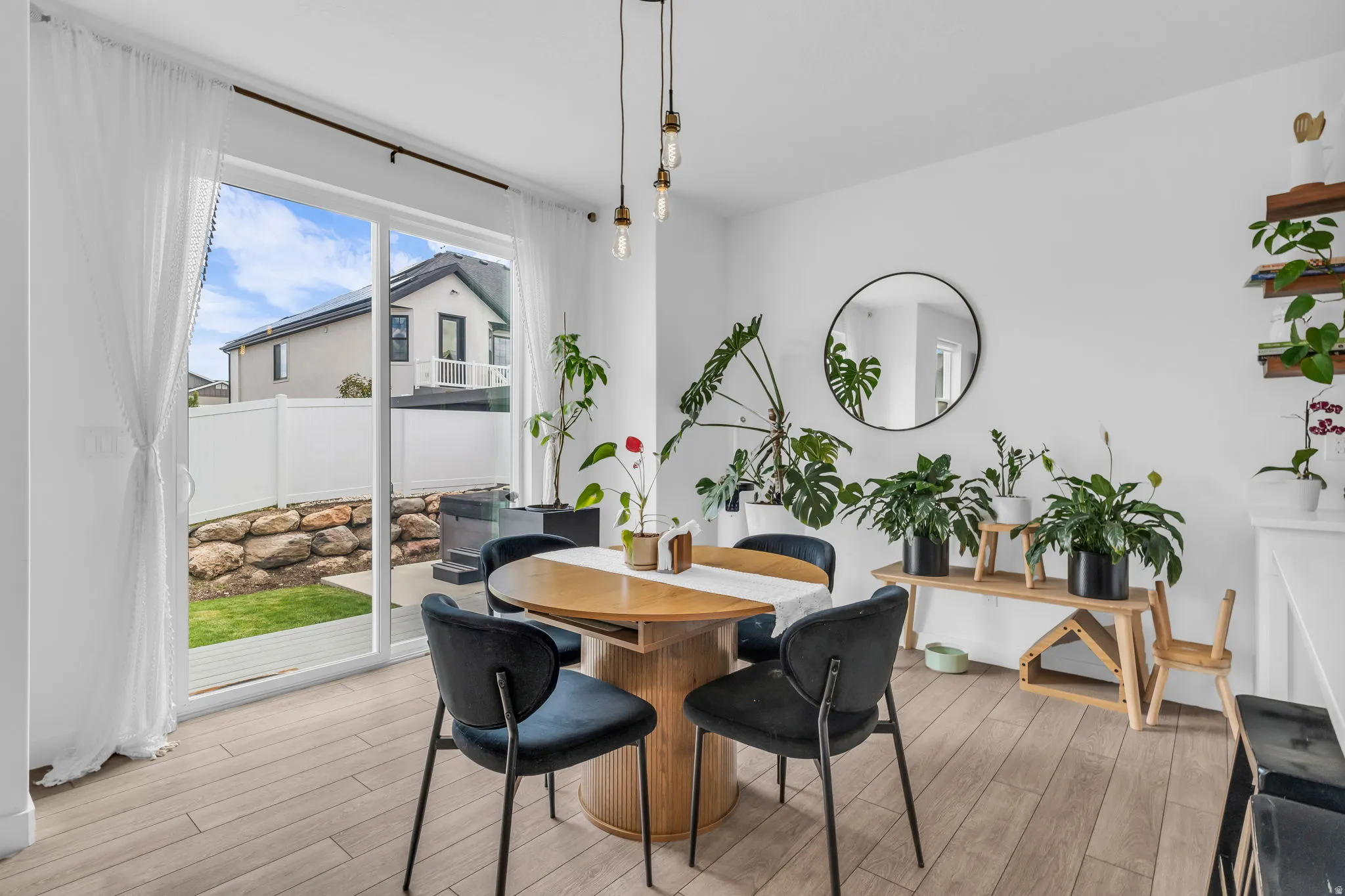 Bright interior space featuring light wood-finish flooring and a white color palette