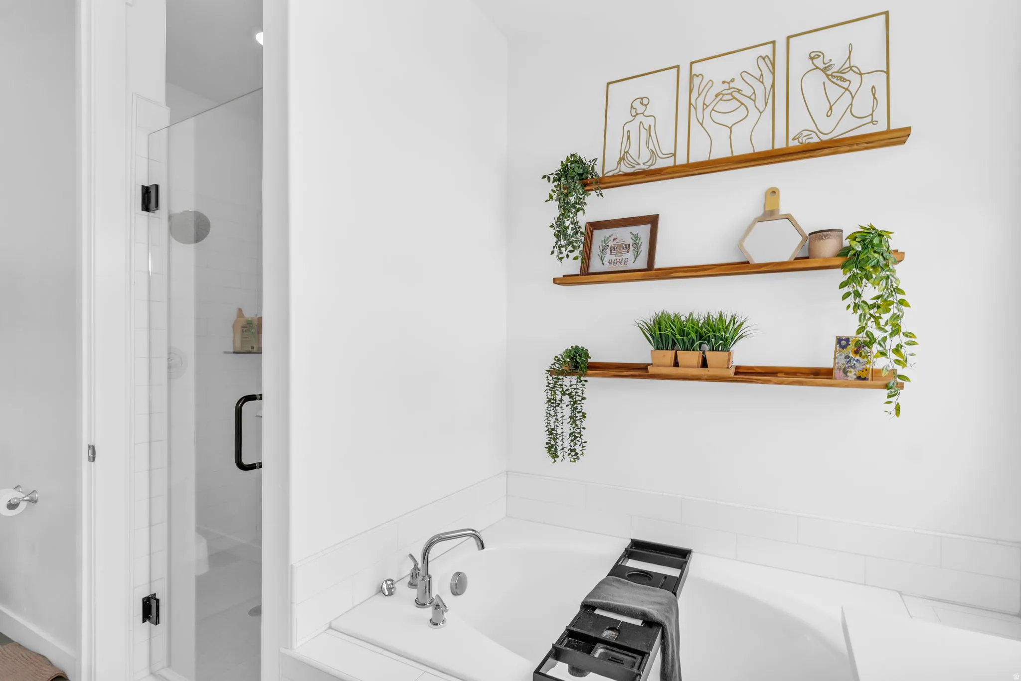 Built-in soaking tub featuring polished chrome fixtures