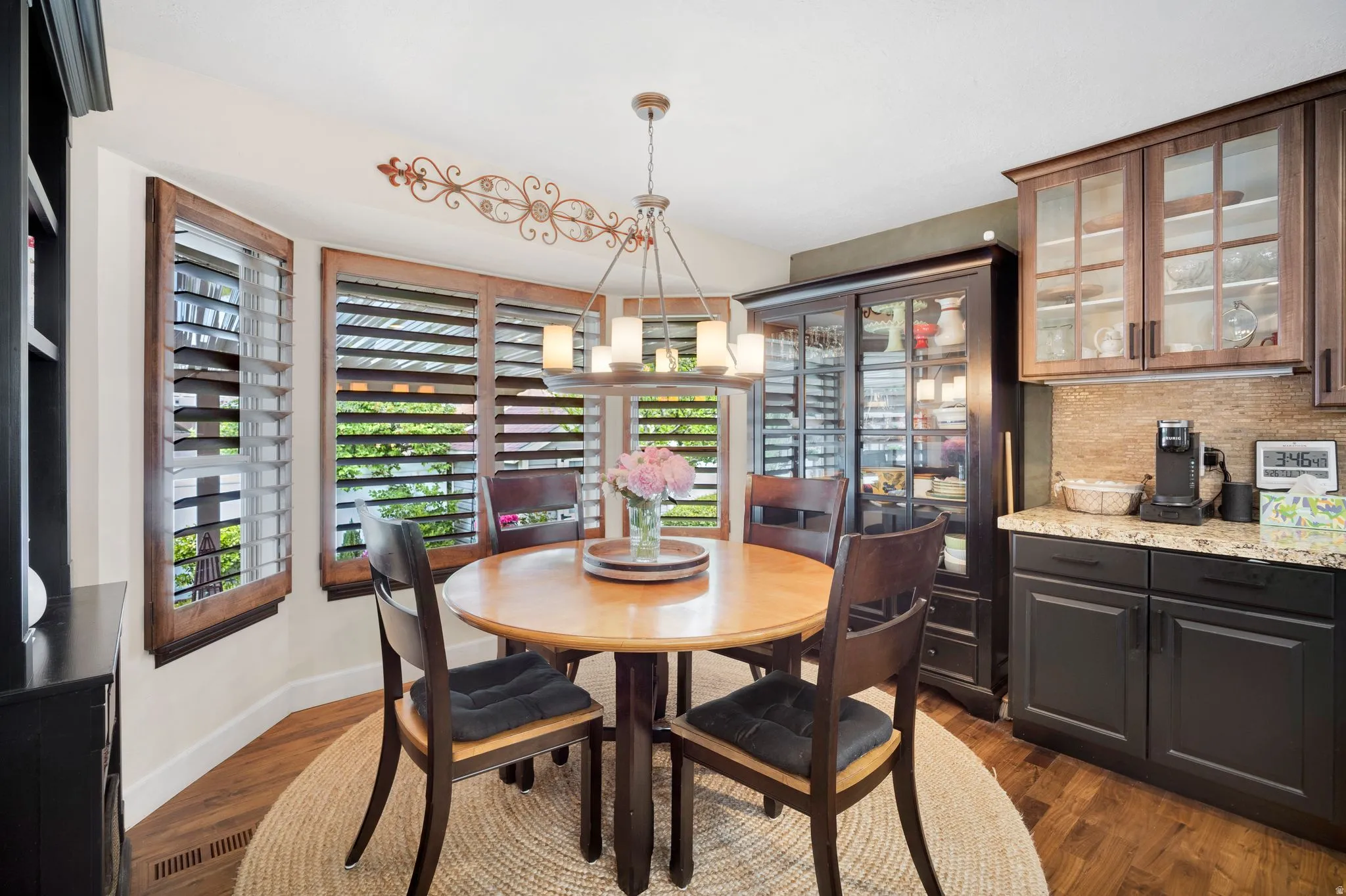 Dining area looking out into beautiful backyard.