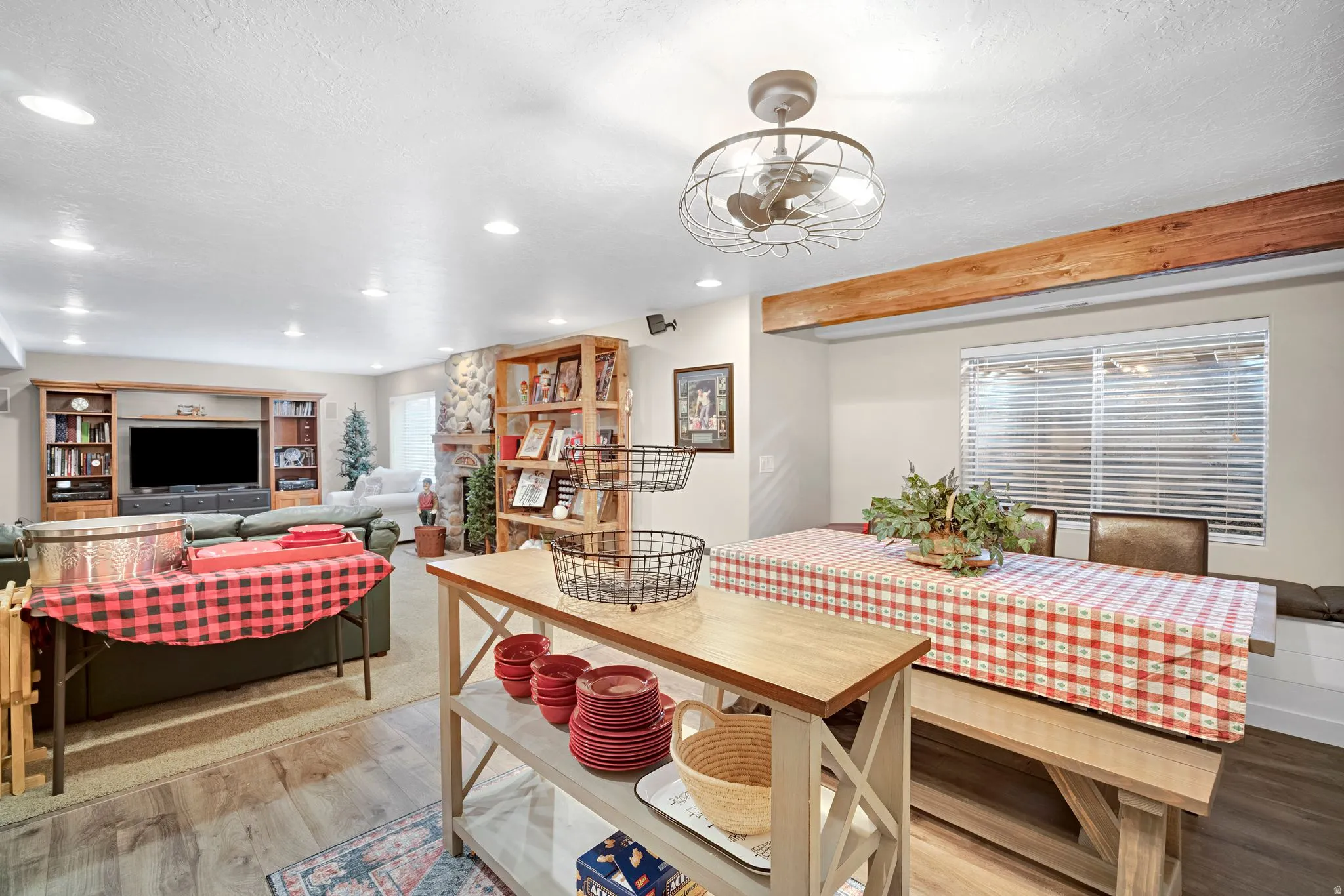 Open-concept recreation area with recessed lighting, beautiful second kitchen and large dining area.