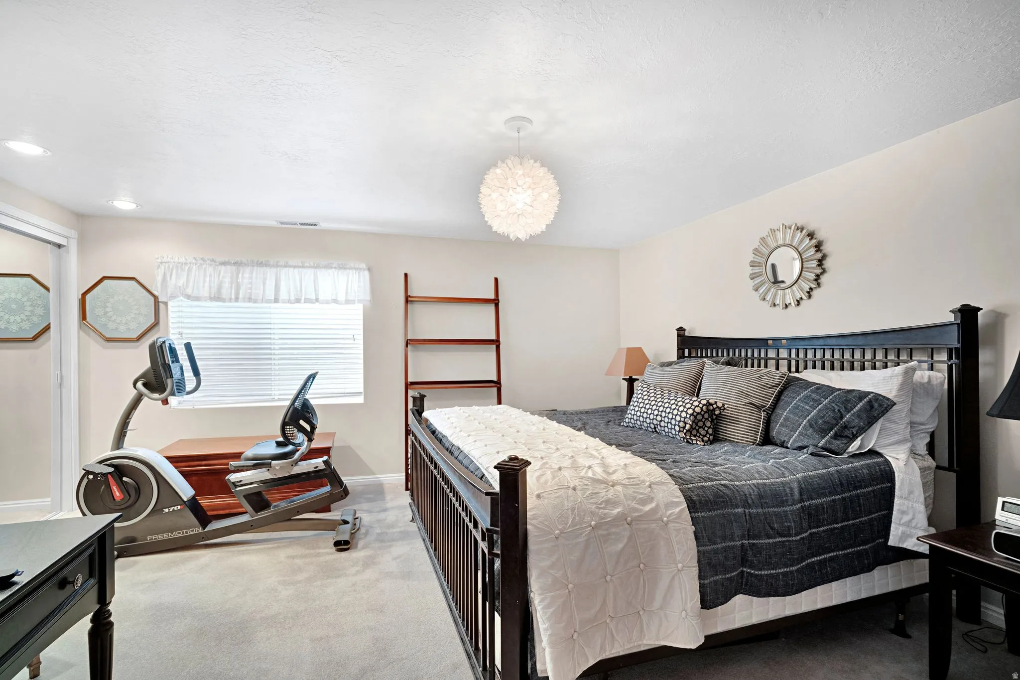 Large bedroom in basement with mirrored, oversized closet (this is a king sized bed in the photo - this is a nice sized room).