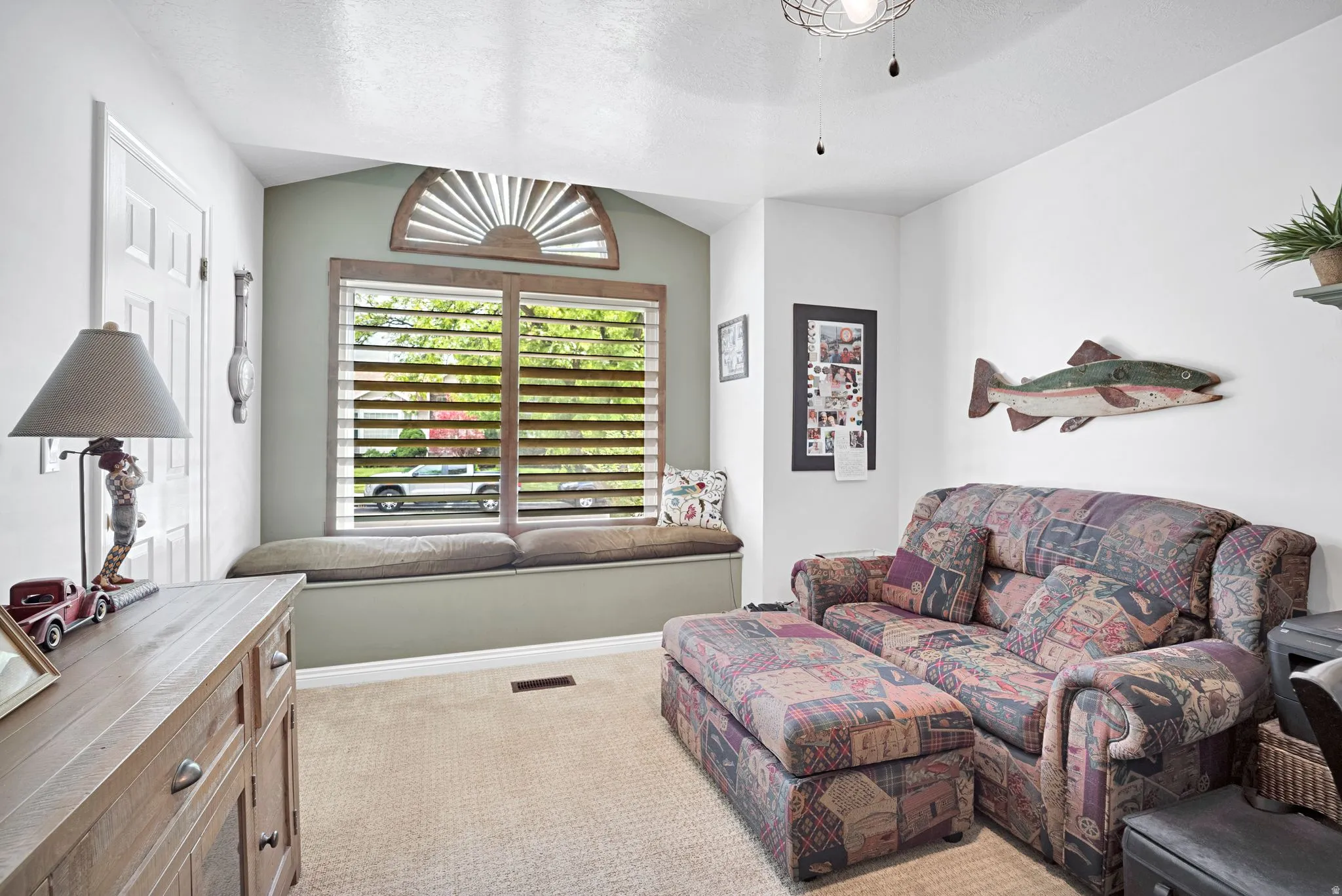 2nd bedroom on main floor featuring a window seat (with storage) and walk-in closet.