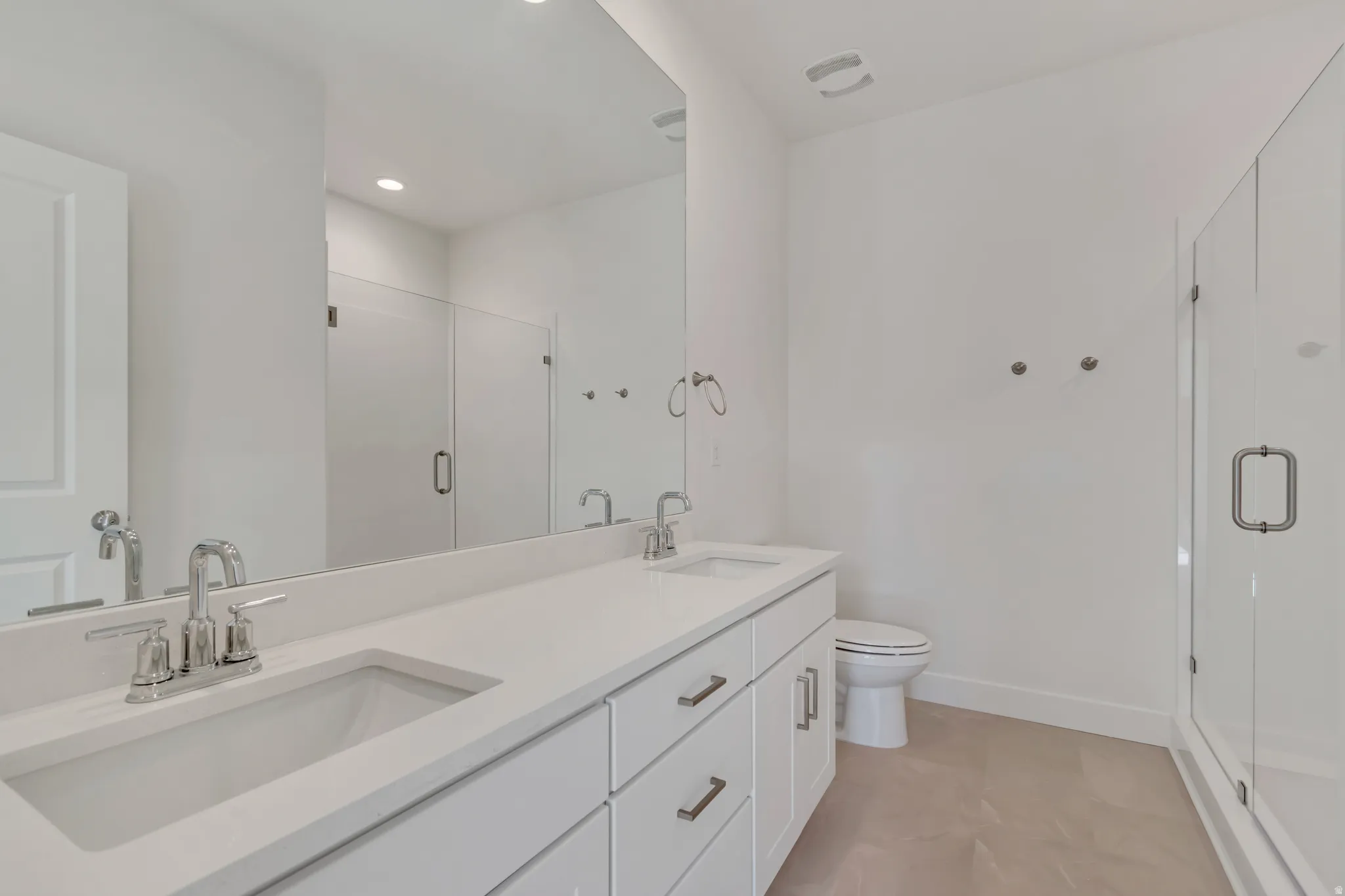 Owner's bath featuring a double vanity and a Full Euro shower.