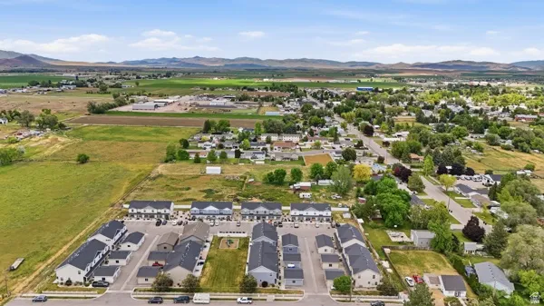 New construction townhome community featuring contemporary architectural styles and ample parking