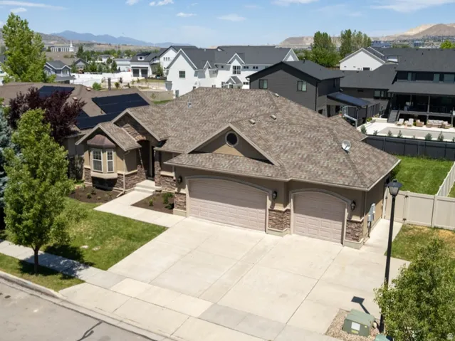 Rambler with three car garage, large driveway