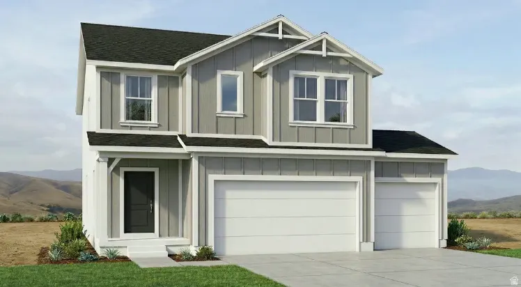 Two-story residence featuring a gray and white exterior with board and batten accents