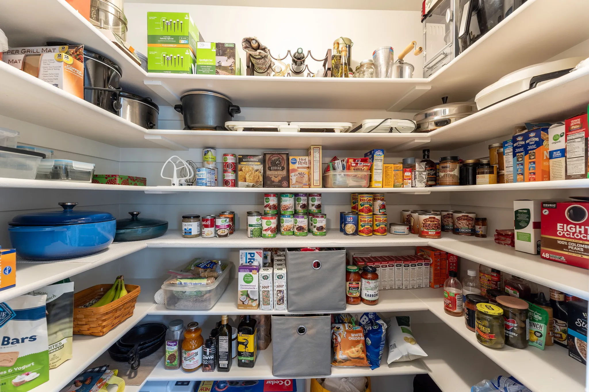 Walk-in pantry featuring extensive shelving