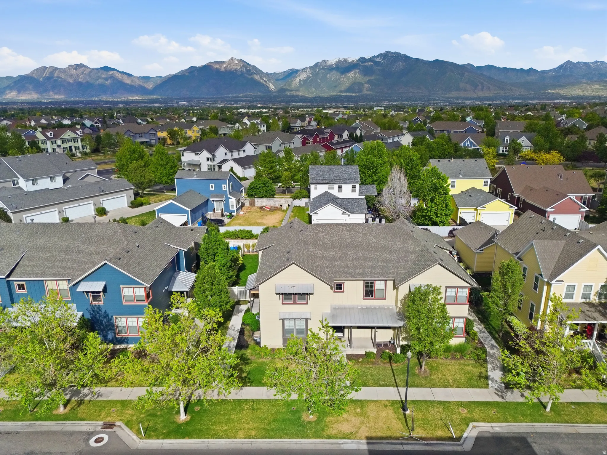 Residential neighborhood featuring a variety of home styles and mature trees