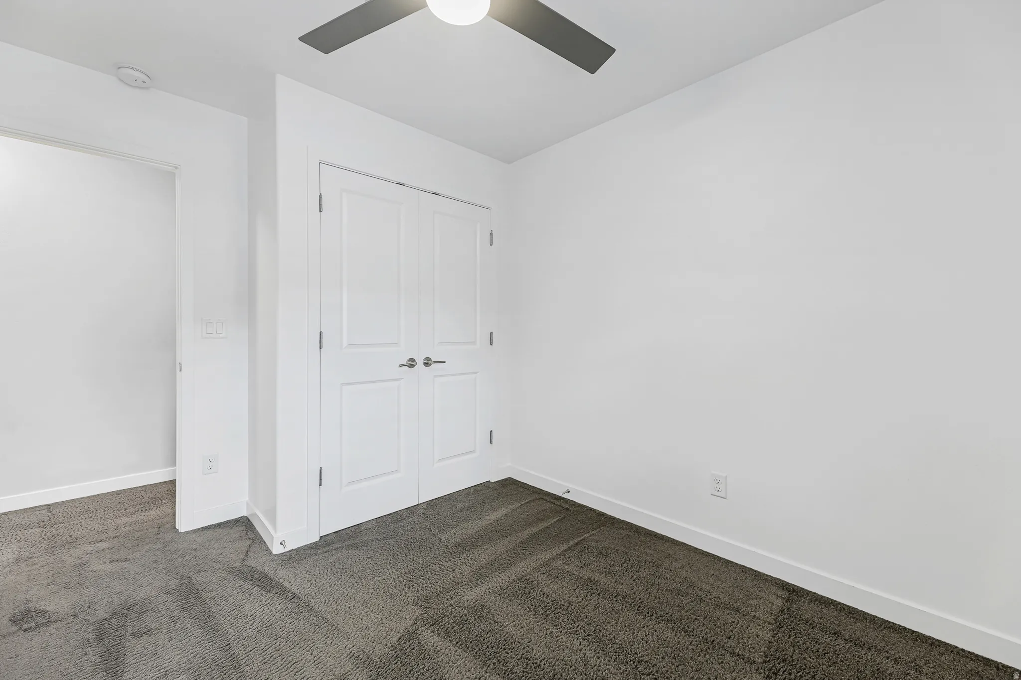 Neutral wall finishes with a ceiling fan, recessed lighting, and a double-door closet