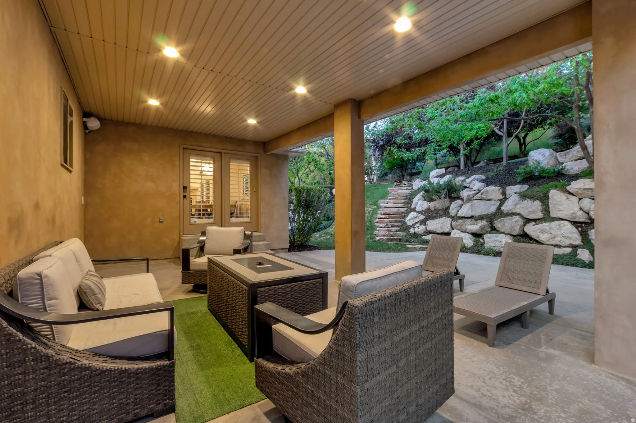 Covered patio featuring recessed lighting and a stucco wall finish
