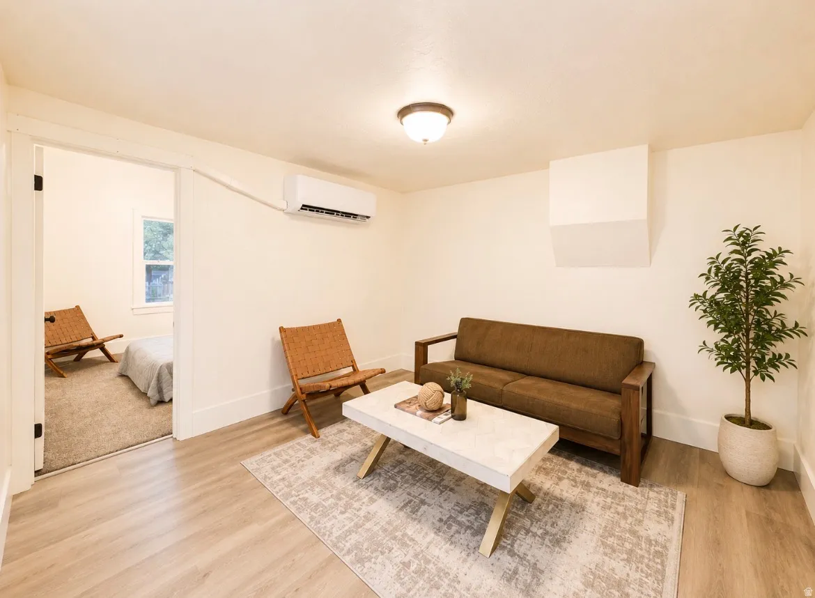Unit 2 living room. Light wood-finish flooring complements neutral wall tones