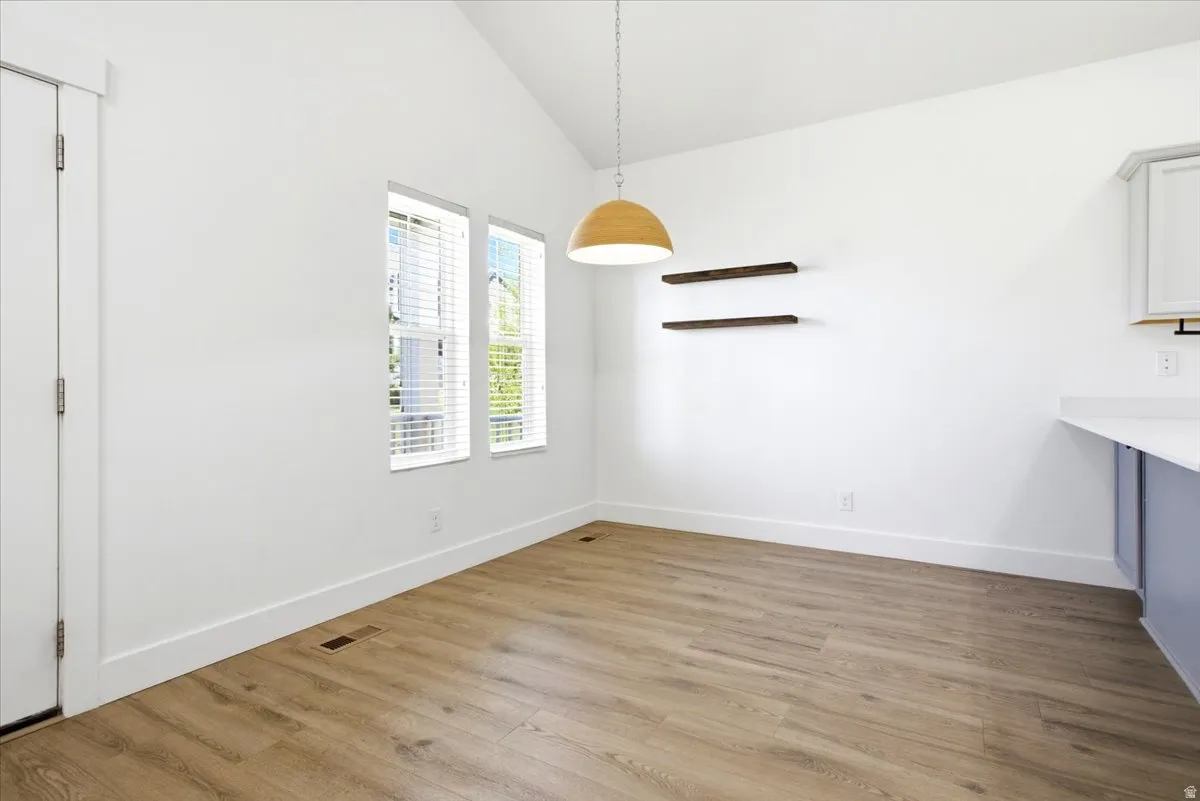 Vaulted ceiling with a wood-finish pendant light fixture