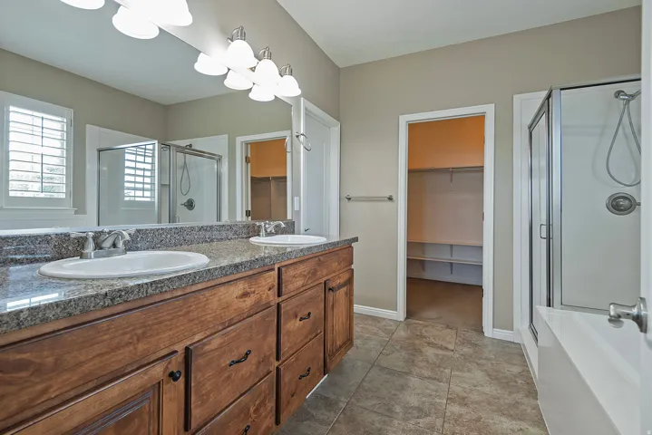 Dual vanity with granite countertop and undermount sinks
