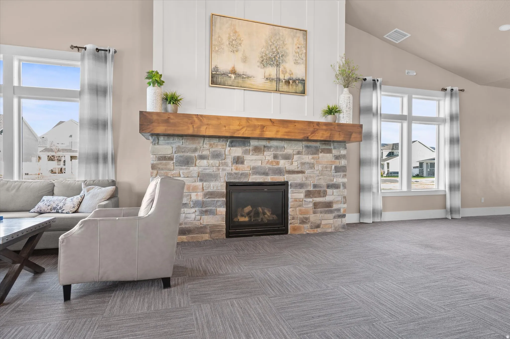 Stone-clad fireplace with a substantial wood mantel
