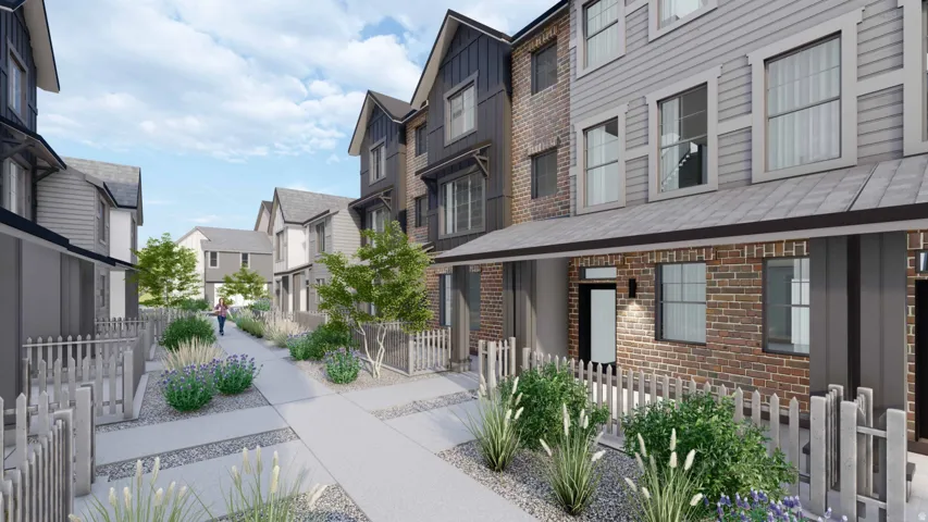 Modern townhome exteriors featuring brick and siding finishes, gabled rooflines, and a covered entryway