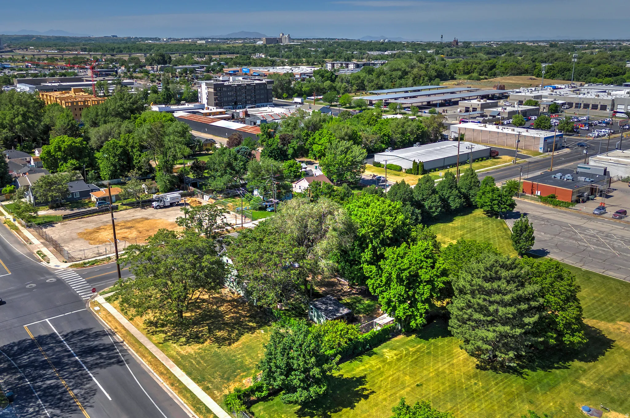 Expansive lot featuring mature trees and established landscaping
