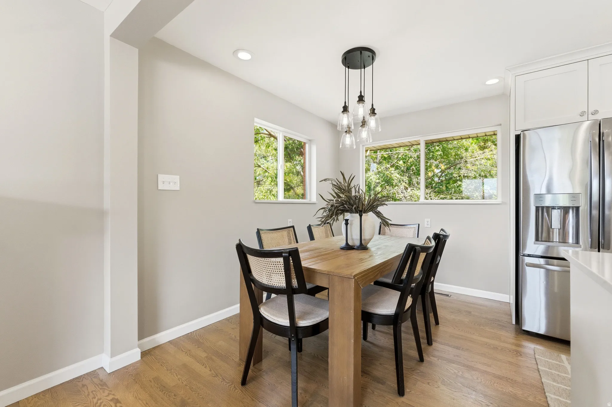 Dining area featuring wood-finish flooring and neutral wall tones