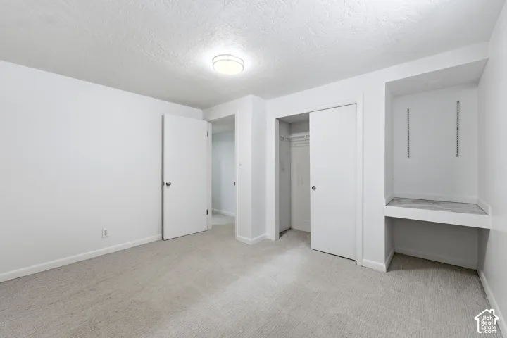 Neutral-toned carpeting paired with white walls