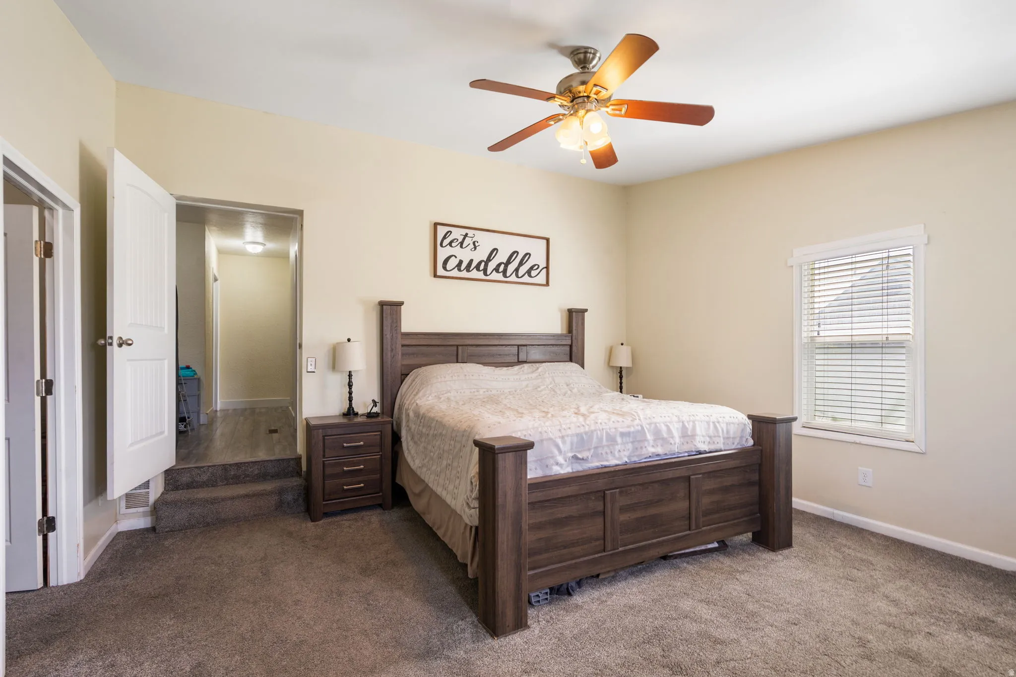 Room with neutral-toned walls and carpeted flooring