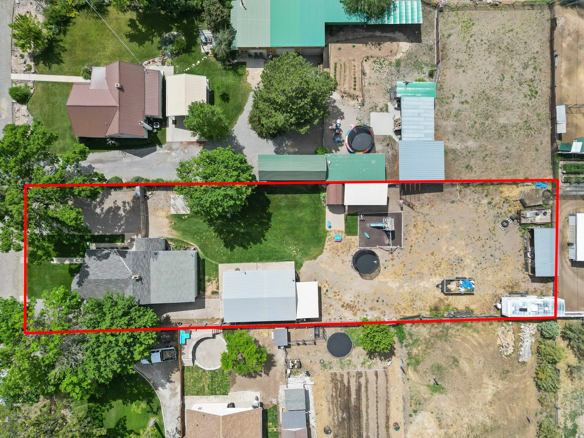 Aerial perspective showcasing a parcel of land with varied ground cover